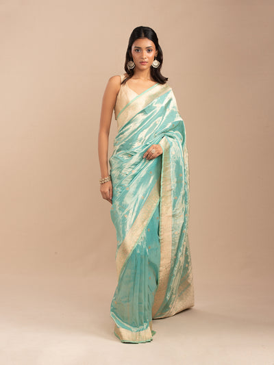 Sea green and gold tissue saree