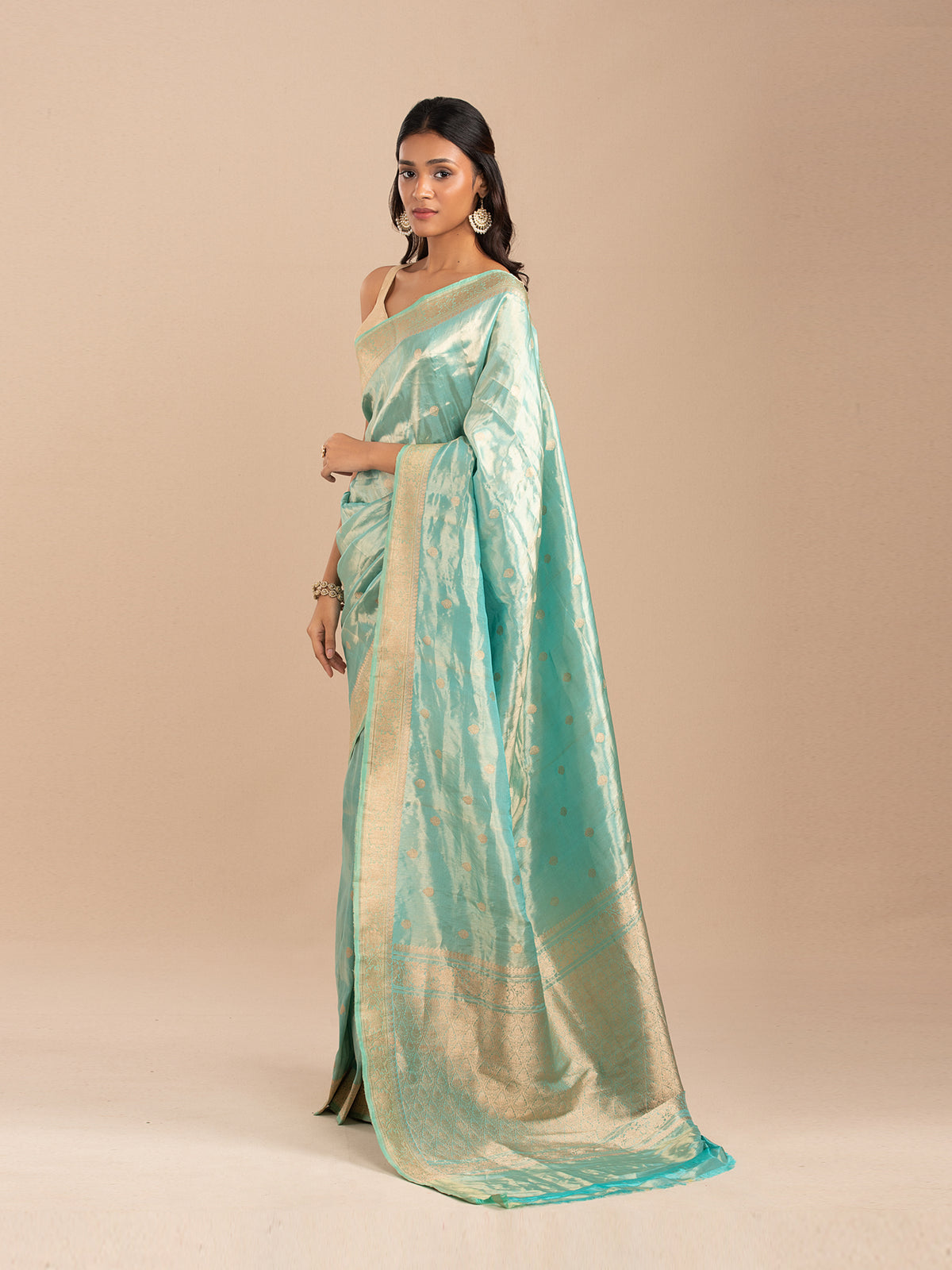 Sea green and gold tissue saree