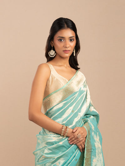 Sea green and gold tissue saree